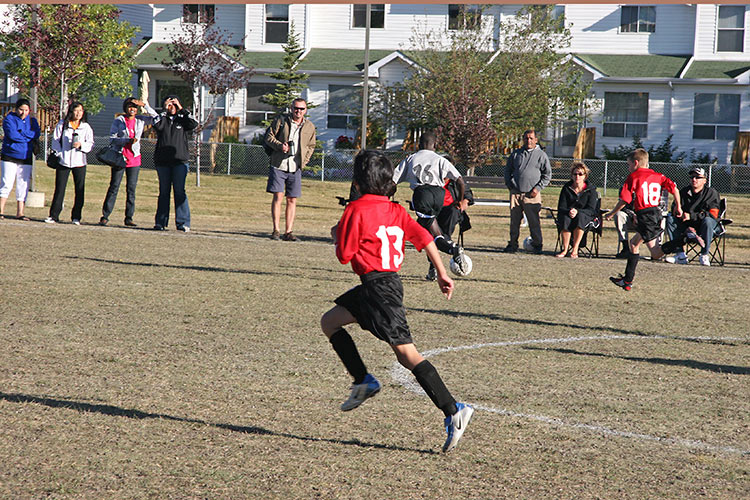 the Fish Creek Fighters (in red) playing <br />their last game of the season...