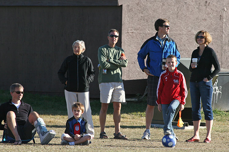 while parents watch from the sideline...