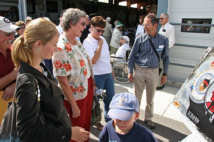 Admiring the commemorative panel.