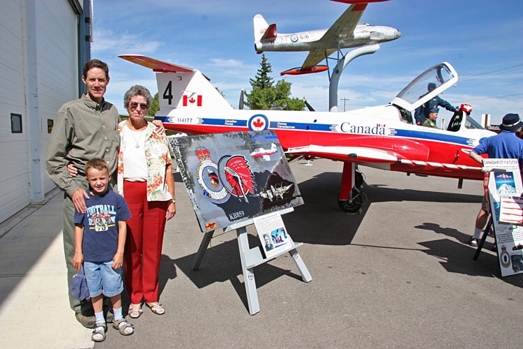 Ian, Riley and Marg with the 431 Squadron commemorative panel.