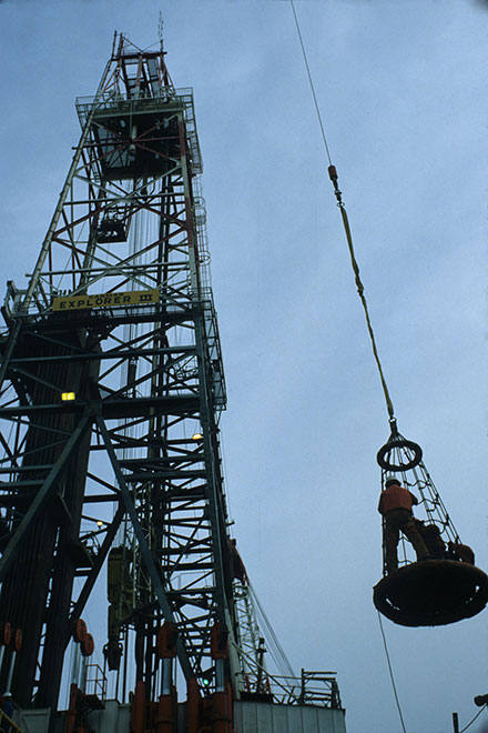 workers moving between <br />vessels with the sling...