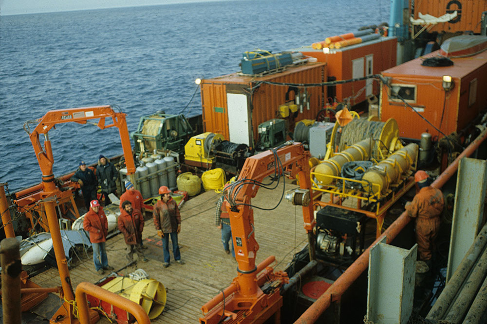 leaving the ship after two weeks aboard. <br />Carried over to the drillship by a sling...