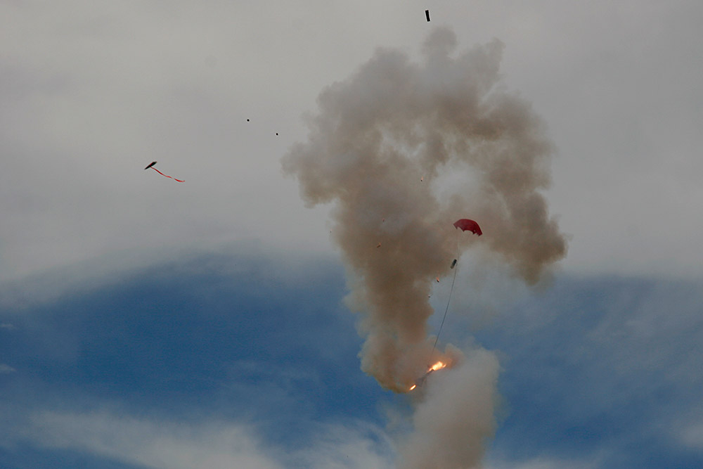 it appears a failure of the motor end cap caused the <br />escape of propellant into the forward section...