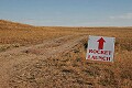 Somewhere, about 50 miles southeast of Lethbridge, Ab, down a <br />lonely country gravel road, we managed to find this sign...